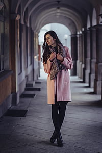 woman standing on hallway during daytime thumbnail