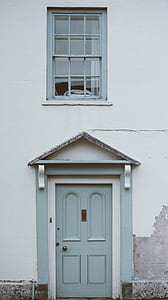 close gray door with window above thumbnail