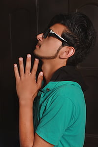 man wearing sunglasses praying thumbnail