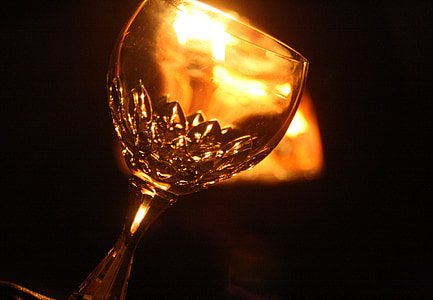 closeup photo of footed drinking glass with black background thumbnail