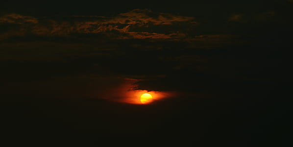 sun covered with clouds during sunset thumbnail