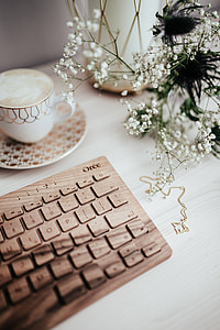 Wooden keyboard and cup of coffee thumbnail