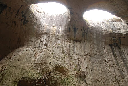 low angle photo of cave at daytime thumbnail