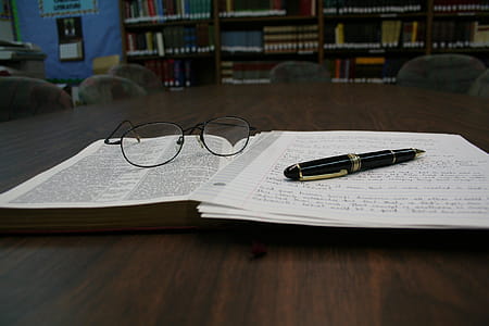 Opened White Notebook on Tabletop thumbnail