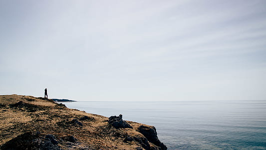photo of human on the top of the rocks thumbnail