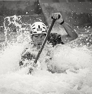 grayscale photo of a man rowing a boat thumbnail