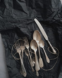 Photo of Stainless Steel Cutlery on Black Cloth thumbnail