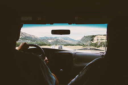 man driving vehicle during daytime thumbnail