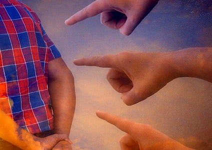 three person pointing at person wearing red and blue plaid shirt thumbnail