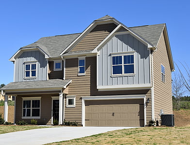 brown and white 2-storey concrete house thumbnail