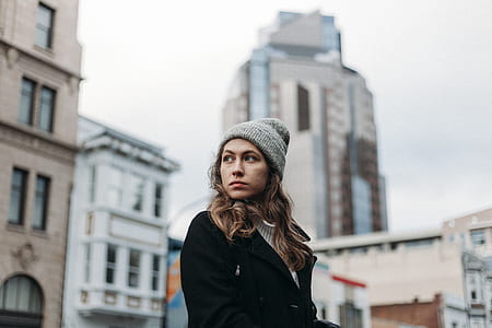 woman standing near building during daytime thumbnail