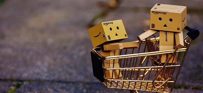 two brass-colored toys on basket thumbnail
