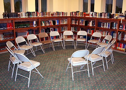 circle of folding chairs inside room thumbnail