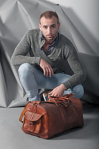 man wearing gray knitted long-sleeved shirt thumbnail