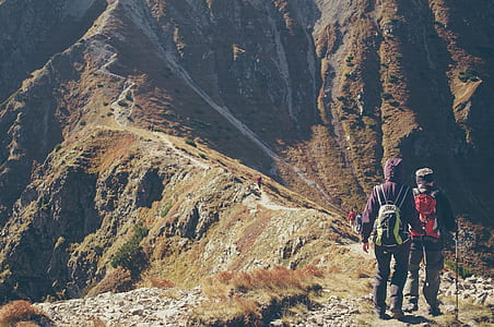 people climbing mountain during daytime thumbnail