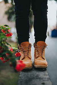 person wearing brown leather work boots thumbnail