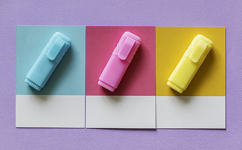 three assorted-color marker case decor on wall thumbnail