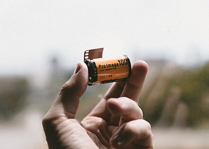 person holding Pro Image 100 film thumbnail