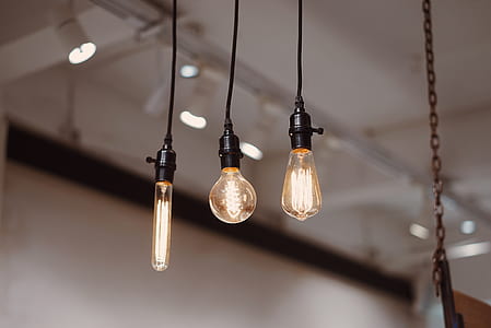 shallow focus photography of three pendant lamps thumbnail