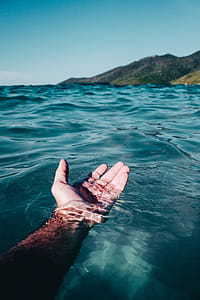 Person Soaking On Body Of Water thumbnail