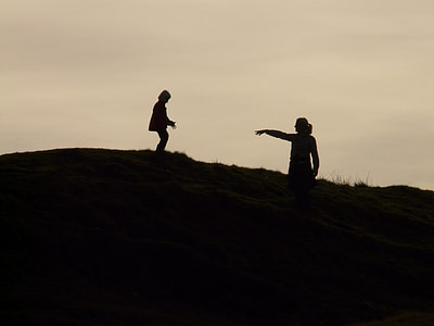 silhouette of baby and woman during golden hour thumbnail