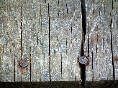 two gray iron nail on gray wood boards thumbnail