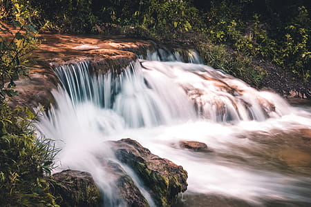 Time lapse Photo of Waterfall Surrounded by Grass thumbnail