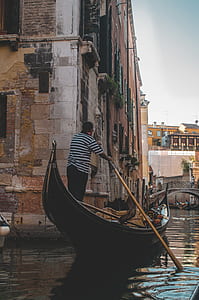 man on canoe boat maneuvering the boat thumbnail