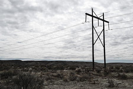 Photograph of Electrical Post on Cloudy Day thumbnail
