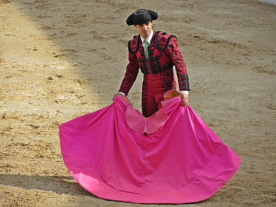 matador wearing red and black holding pink text thumbnail