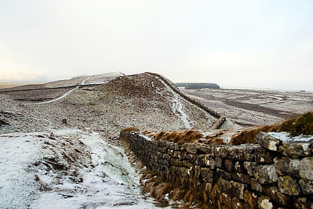 concrete fence beside hill thumbnail