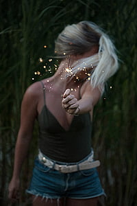 woman holding sparkler thumbnail