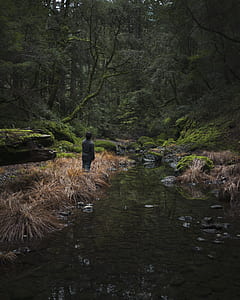 man standing in front of body of water outdoors thumbnail