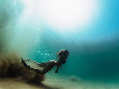 woman swimming underwater at daytime thumbnail