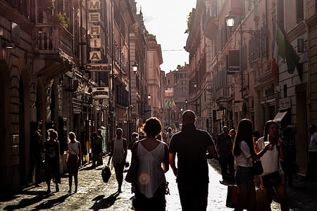 woman and man walking on road near building thumbnail