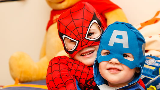 two boy's wearing Marvel Spider-Man and Captain America masks thumbnail