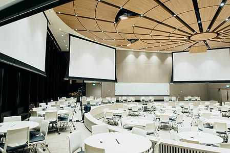 table setup in a well-lit auditorium thumbnail