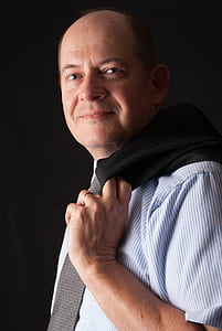man wearing blue and white striped short-sleeved shirt thumbnail