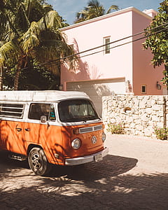 orange and white Volkswagen car at the road thumbnail
