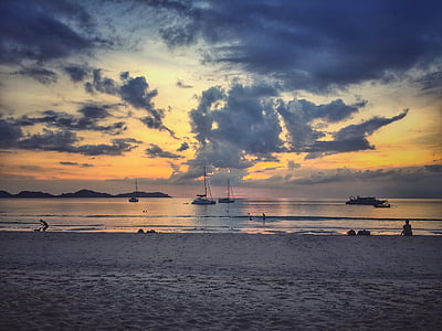 sailing boat on body of water during golden hour thumbnail