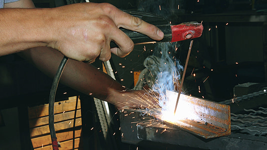 person welding stainless steel bracket thumbnail