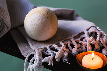 white concrete sphere on gray knitted scarf thumbnail