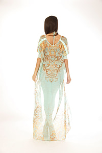 woman standing facing wall thumbnail