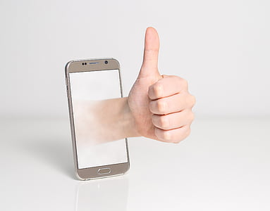 silver Android smartphone with left hand with white background thumbnail