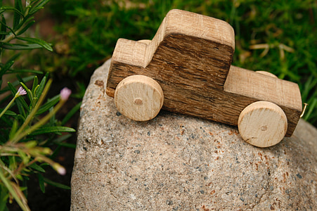 brown wooden car on gray stone thumbnail