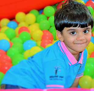 boy wearing blue and pink polo shirt thumbnail