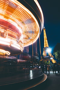people standing near Eiffel Tower during night time thumbnail