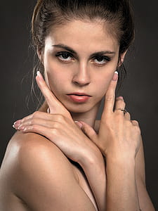 topless woman wearing silver-colored ring taking selfie thumbnail