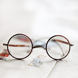 photo of round eyeglasses with brown frames thumbnail