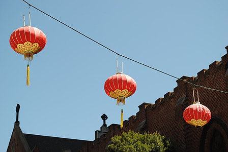 three red outdoor lanterns thumbnail